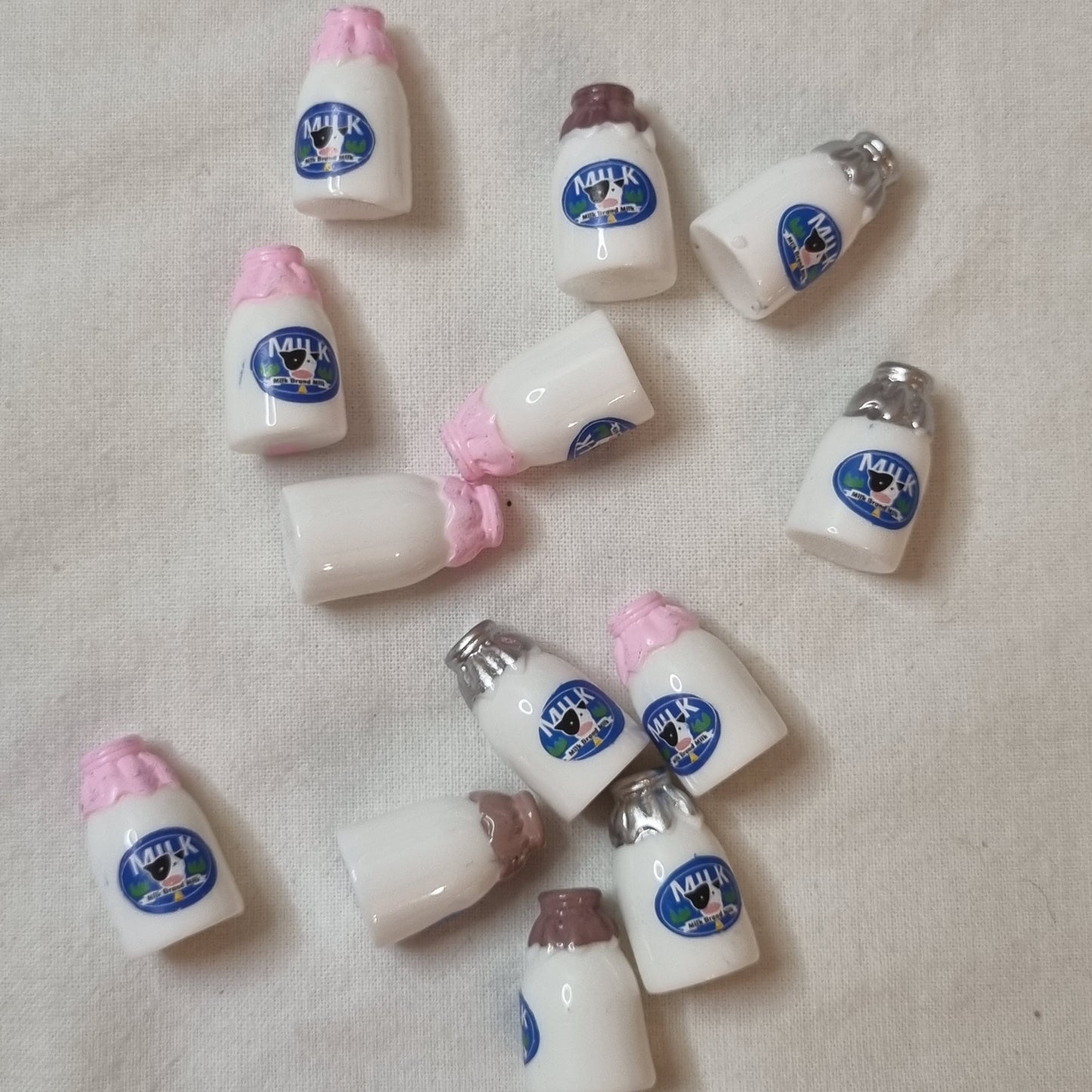 Mixed colour top milk bottles